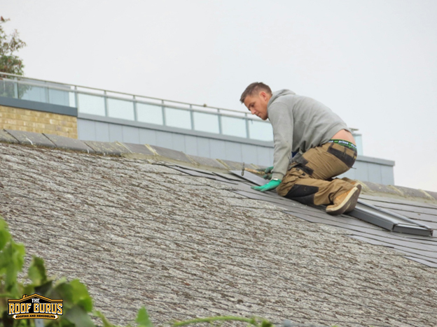 Roof repair in progress on residential home
